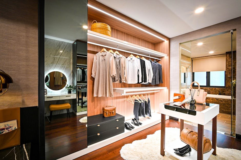 Elegant and organized walk-in closet featuring stylish clothing and accessories.